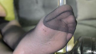 Feet is in black pantyhose after photoset. Soles close ups.