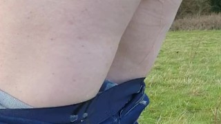 Gf wets her Jean's walking in the countryside then Pulls her Jean's down! 