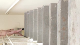 Nude in a con hotel stairwell.