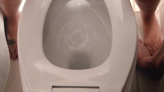 Her Standing to Piss in Toilet