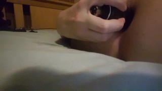 Cute femboy plays with his black dildo