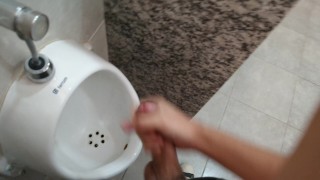 Cumming at public urinal