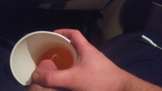 Pissing into a Mc Cup