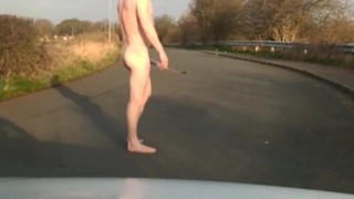 Naked in road with pump on