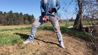 Outdoor play with her pierced and tattooed pussy in jeans