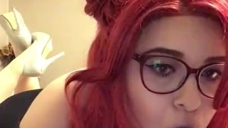 Redhead sucks a huge 12 inch dildo 