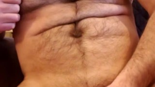 Muscle bear flexes and drops thick cumshot!