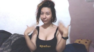E-girl massages her head and shakes her breasts, they jump out ..