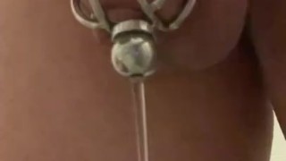 Caged sissy slave pee through urethral plug 