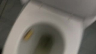Peeing in the toilet.