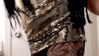 Hot crossdresser wearing shiny gold tight dress