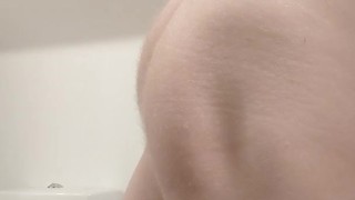 Caged brushing teeth and showing ass