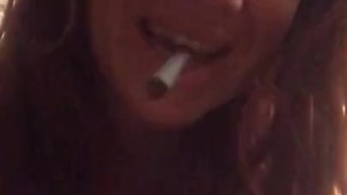 Sexy smoking cougar relaxes after essential employee work with foot rub