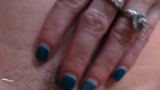 Horny athletic Milf smokes and rubs her pussy while stripping at home