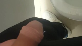 Pissing in a public toilet