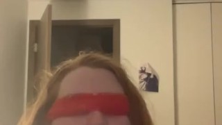 Gagging blindfolded on a dildo