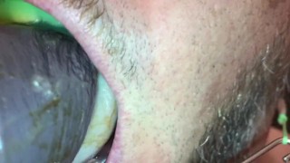 Suck dildo with headgear and mouthguard