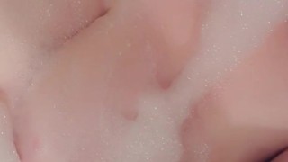 BBW plays with soapy tits in bath