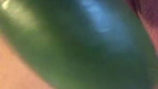 BBW fucks herself with big cucumber