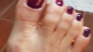 Painting my red toe nails purple! 
