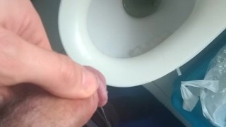 peeing into the toilet