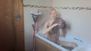 sexy skinny blonde teen takes a bath and wets his hair and cock