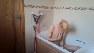 sexy skinny blonde teen takes a bath and wets his hair and cock