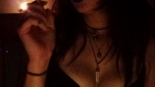 Smoking a bong and a cigarette by candlelight