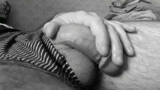 Boy massages his dick. Big penis with saliva.