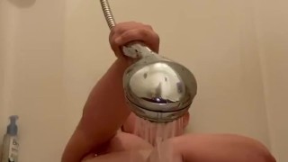 Juicy girl has quick shower head orgasm