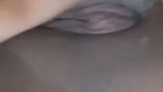 Asian girl creaming while fingering herself