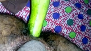 Inserting huge cucumber in asshole