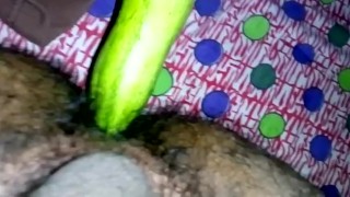 Inserting huge cucumber in asshole