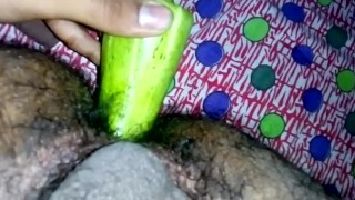 Inserting huge cucumber in asshole
