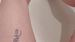Trans boy rubbing and pissing in the bathtub