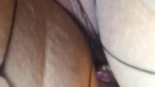 Masturbating with vibrator and butt plug wearing fishnets