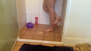 Girlfriends cute little feet in the shower getting washed and scrubbed