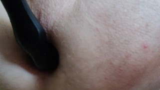 Guy play with ass toy.