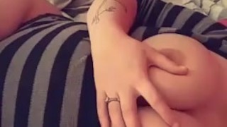 Teen playing with tits in bed