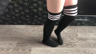 teen girl show her college knee high black socks