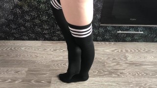 teen girl show her college knee high black socks