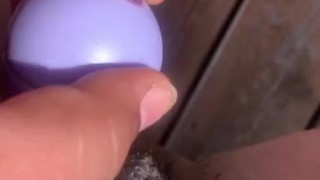 Bbw using toy outside on her porch