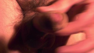 Adult man jerk offs his dick with two fingers and hand (close up)