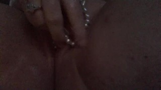Girl gets naughty with pearl necklace 