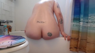 Pawg plays with slippery dildo in the bathtub 
