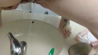 Pissing in the bathroom sink