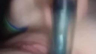 Girl using dildo to masturbate