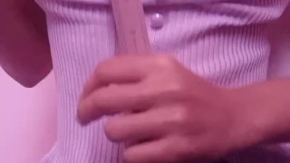 Asian teen smacking her tits with ruler hard