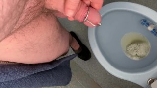 Pissing through a urethra plug - stimulate the flow through penis