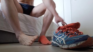 That guy comes home and removes his trainers and socks